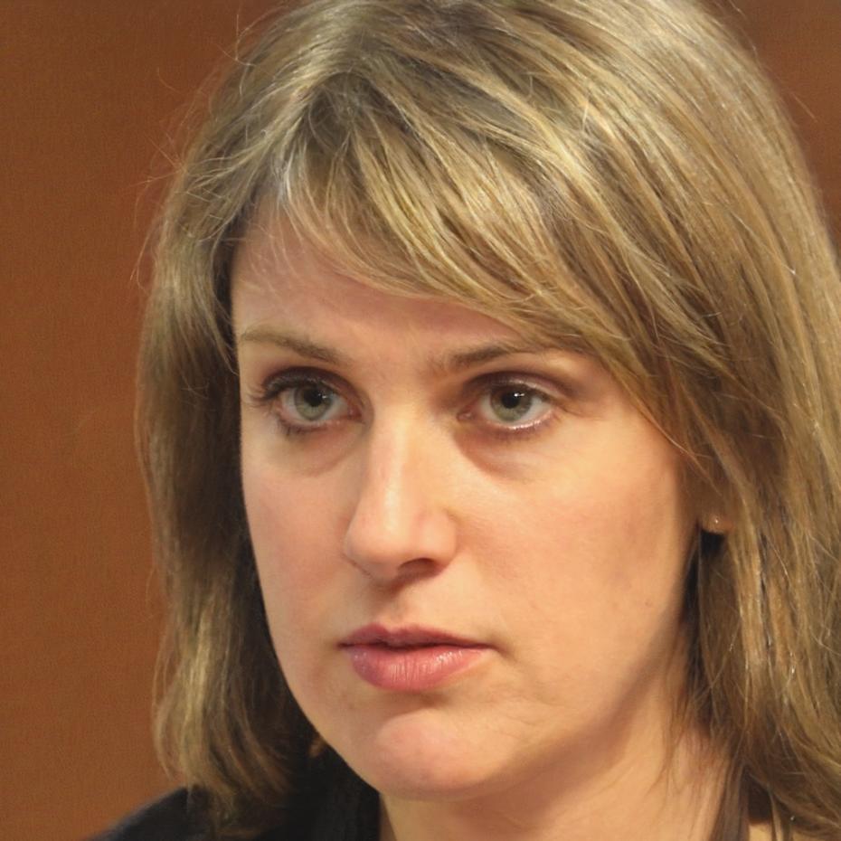 Elara Thornfield reviewing financial documents